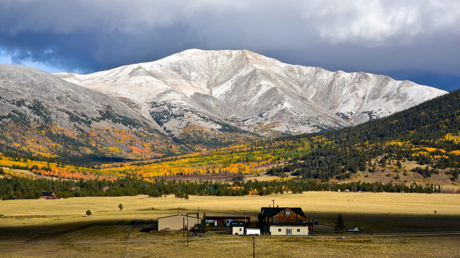 Mount Silverheels rising above autumn aspen groves and ranchland in Park County, Colorado
